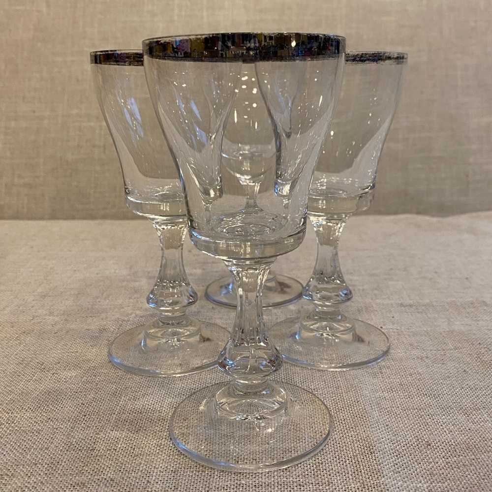 Silver trimmed wine glasses with some wear on silver trim. Set of 4.